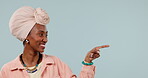 Mockup, black woman and hands point at product placement for marketing and advertising in studio with yes gesture. Smile, person and show display choice or option for deal or sale on blue background