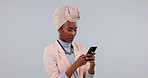 Serious, black woman and smartphone with stress, typing or social media on white studio background. African person, girl or model with a cellphone, mobile user or angry with digital app or connection