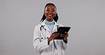 Doctor, woman and tablet for medical planning, clinic results and schedule or telehealth services in studio. Professional african person in healthcare, digital tech or happy face on white background