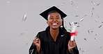 Excited black woman, graduation and celebration with confetti, certificate or winning against a studio background. Portrait of happy African female person, student or graduate with diploma in success