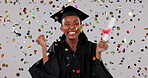 Confetti, celebration and woman, graduation and success at event with education achievement in studio. Party, African graduate is happy and excited with cheers for award or reward on white background