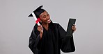 Happy black woman, graduation and tablet dancing in celebration, certificate or winning against a studio background. Excited African female person, student or graduate smile for diploma or technology