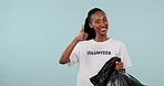 Plastic bag, black woman point or volunteer thumbs up for trash cleaning agreement, climate change feedback or recycling. Studio mockup space, NGO vote or Nonprofit portrait person on blue background