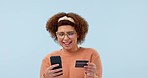 Credit card, phone and happy dance by woman in studio with cashback reward on blue background. Smartphone, app and female model with online shopping sale, deal or sign up, investment or celebration