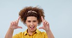 Happy, finger camera and face of woman in a studio with good, positive and happiness attitude. Smile, excited and portrait of young female model with hand photography gesture by white background.