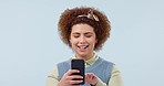 Phone, smile and young woman in studio typing message on social media, mobile app or the internet. Happy, technology and female model from Mexico networking on cellphone isolated by white background.