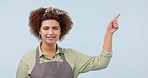 Barista, pointing and face of woman in studio with list for options, decision and choice. Small business owner, cafe and portrait of person with gesture for promotion, deal or news on blue background