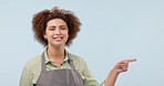 Woman, pointing and advertising presentation with list, information or news, barista smile on blue background. Portrait, mockup space and cafe launch announcement with menu and marketing in studio