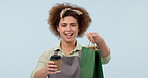 Woman, waitress and coffee with paper bag, food and smile for good service, blue studio background. Portrait, business woman and barista for serving customer, startup business and cafe hospitality