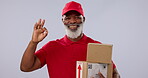 Delivery boxes, mature black man or okay sign for logistics courier, product shipping or studio opinion vote, agreement or service. Emoji ok icon, export package or portrait person on grey background