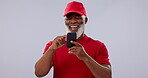 Phone, funny and social media with a senior black man in studio on a gray background for communication. Contact, smile and an elderly person laughing at a comic, meme or internet post on his mobile