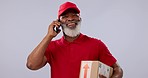 Senior, black man and phone call for delivery, box or logistics against a studio background. Mature African male person or courier guy talking on mobile smartphone with parcel, package or cargo