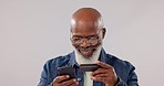 Senior, black man and phone with credit card for ecommerce or banking against a studio background. Happy mature African male person with mobile smartphone for online shopping, payment or bank app