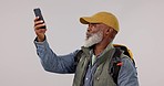 Phone, problem and senior man hiking in studio with internet, glitch or 404 on white background. Smartphone, fail and frustrated old guy hiker with app, connection or reception crisis while traveling