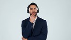Thinking, business and man with telemarketing, call center or problem solving on a white studio background. Person, consultant or model with headphones, crm or customer service with solution or ideas