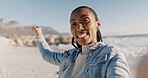 Selfie of black woman on beach, walk and smile on summer holiday on tropical island with live stream. Photography, social media and happy influencer girl on ocean vacation for blog post or video call