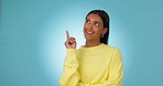 Happy, thinking and woman with idea or pointing hand to decision or solution in studio, mockup or blue background. University student, planning and presentation of problem solving, question or advice