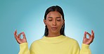 Lotus, breathing or woman in meditation in studio for wellness, peace or balance on blue background. Calm, hands or Indian girl in yoga pose for energy training, mental health or holistic exercise