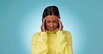 Headache, woman and pain in studio for stress, vertigo and mental health on blue background. Frustrated, tired and sad indian model massage temple for anxiety, bad mistake and challenge of depression