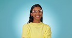 Woman, glasses and face with eye care in studio, smile and excited for choice, vision and fashion by blue background. Gen z girl, student and happy nerd with eyesight, prescription lens and frame