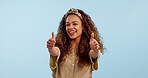 Face, smile and thumbs up of woman in studio isolated on a blue background mockup space. Portrait, like hand sign and happy person in agreement, approval of feedback in excellence and ok for success