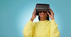 Vr, 3d or happy woman in metaverse studio for innovation or future gaming on blue background. Futuristic media, technology software or excited girl gamer with digital virtual reality glasses online 