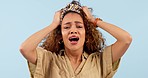 Crying, stress and face of woman in studio with anxiety, frustrated and broken heart on blue background. Depression, portrait and sad lady model with tears for death, disaster or mental health crisis