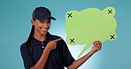 Happy woman, delivery and pointing to speech bubble for social media or advertising against a studio background. Portrait of female person or courier lady with shape for feedback or comment on mockup