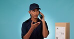 Phone call, box of courier and angry woman talk, chat or shipping in studio isolated on a blue background mockup space. Smartphone, delivery person frustrated and communication problem to order cargo