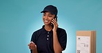 Phone call, box of courier and happy woman talking, chat and shipping in studio isolated on a blue background mockup space. Smartphone, delivery and communication to order cargo, package and parcel