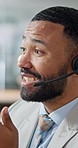 Businessman, call center and face consulting with headphones in customer service or support at office. Closeup of friendly or happy man, consultant or agent talking in online advice or telemarketing