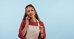 Barista, cafe worker and woman with phone call, chat with supplier and waitress in studio on blue background. Professional, communication and networking, small business and owner with inventory order