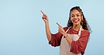 Business owner, woman and pointing to presentation, advertising mockup and restaurant announcement in studio. Face of happy entrepreneur, barista or waitress with menu or cafe news on blue background