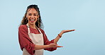 Happy woman, barista or waitress palm gesture with restaurant brand, coffee shop promo or cafe mockup space. Cafeteria information, studio portrait or server show product placement on blue background