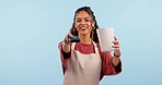 Waitress woman, machine and payment in studio, popcorn and smile on face with service by blue background. Girl, cinema employee and fintech for pos transaction for fast food, snack and catering job