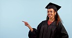 Happy woman, graduate and student pointing at studio news, university promotion or school logo design. Mockup space, college portrait and person gesture at timeline, list or chart on blue background