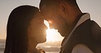 Sunset, beach and couple with face for love by ocean for commitment, bonding and relax in nature. Happy marriage, travel and man and woman for romantic trip on holiday, vacation and anniversary