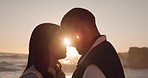 Sunset, beach and couple with face together by ocean for commitment, bonding and relax in nature. Happy marriage, travel and man and woman for romantic trip on holiday, vacation and anniversary