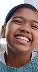 Selfie, face and laughing with a girl child closeup in the living room of her home for playful recording. Portrait, smile and happy young indian kid in her house for a video, movie or film for youth