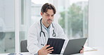 Doctor, tablet and laptop in office for research, telehealth and information with network connection and focus. Professional, healthcare and person with digital pc for health planning and technology