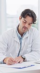 Doctor, checklist and consultation of a man with clipboard for medical and healthcare advice. Hospital, male professional and writing insurance notes for patient symptoms and paperwork in a clinic