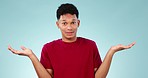 Doubt, shrug and face of man on blue background with gesture for unsure, uncertainty and question. Thinking, confused and portrait of person with hand sign for option, choice and emoji in studio