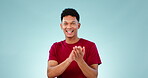 Face, happy man and applause in celebration at studio for congratulations isolated on a blue background mockup space. Portrait, clapping and person smile for achievement of goal, winning and success