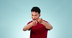 Face, excited and man pointing at you for choice, decision and selection in studio isolated on a blue background mockup space. Portrait, happy person and gesture for recruitment, hiring or greeting