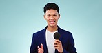 Reporter, face and news, man with microphone with broadcast and live stream isolated on blue background. Journalist, information and announcement, press and media with talk show and story in studio