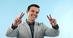 Face, peace and man with a sign, business and support with motivation on a blue studio background. Portrait, person or model with v gesture, review or aesthetic with vote, icon or emoji with feedback