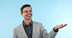 Smile, pointing and young businessman in studio with choice, option or decision hand gesture. Happy, mockup and portrait of professional male lawyer from Canada show marketing or advertising space.