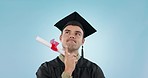 Graduation, man and thinking in studio, ideas and choice with diploma, achievement or goal by blue background. College student guy, certificate and brainstorming, decision or review for future career