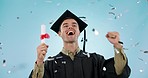 Graduation, man and confetti celebration in studio, smile or fist for achievement, goal or diploma by blue background. Student, certificate and excited for education, winning and glitter for success