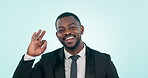 Business man, ok sign and hand studio for good review, feedback or agreement on a blue background. Happy professional black male person with gesture or emoji for approval, perfect and success